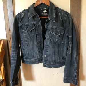 Thrashed black Levi’s trucker jacket